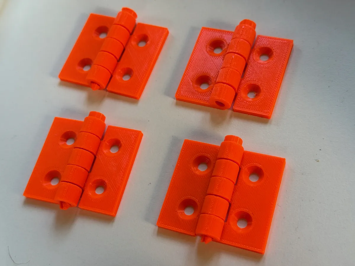 Oranžové 3D tištěné panty (print-in-place) – funkční bez montáže